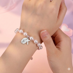 Bransoletka komunijna różowa perełki krzyżyk...